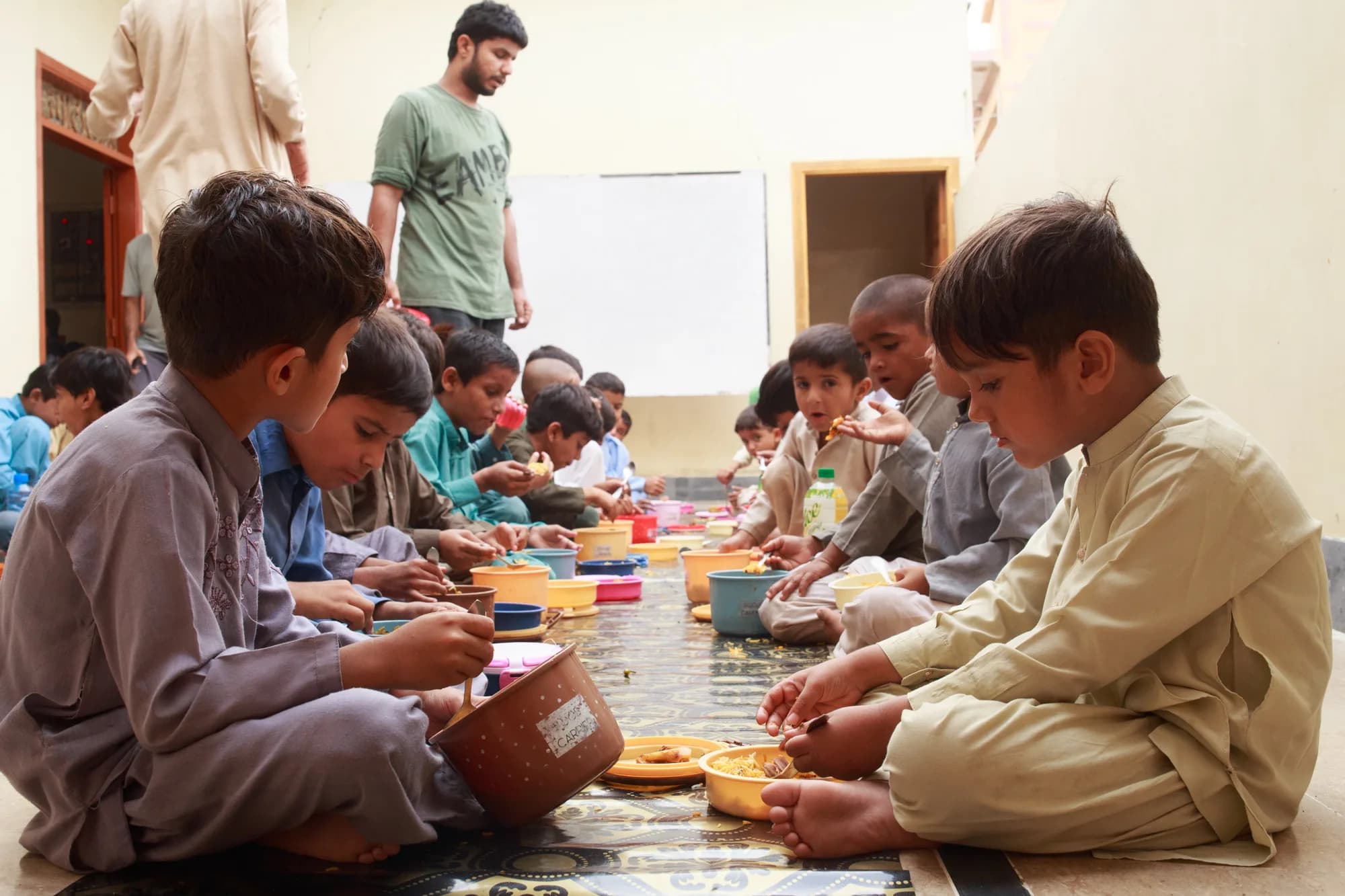 A child receives a meal at a Nourished USA partner school